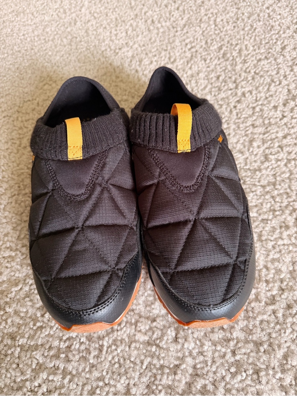 Teva Men's Quilted Slip-On Boots in Black with Orange Accents